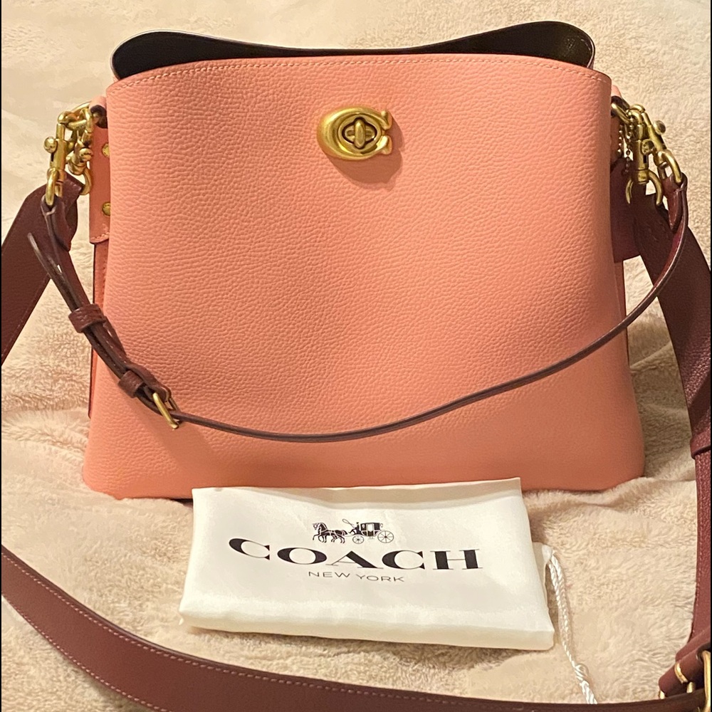 Coach bag style No C2590 Candy pink color it has feet on the bottom very clean